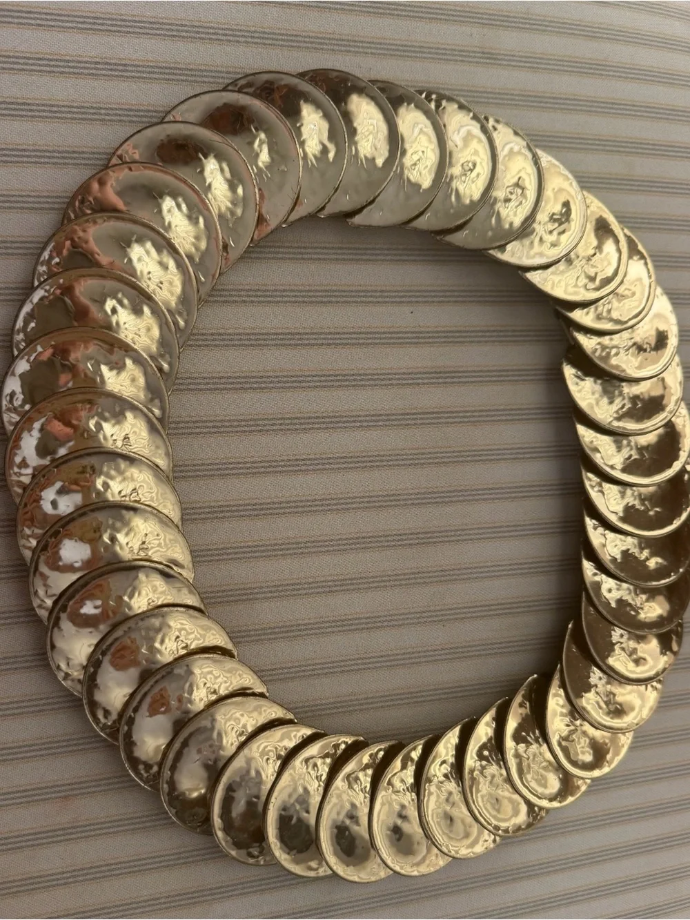 Vintage stretch Concha belt with gold-tone medallions. 28–42 inches long